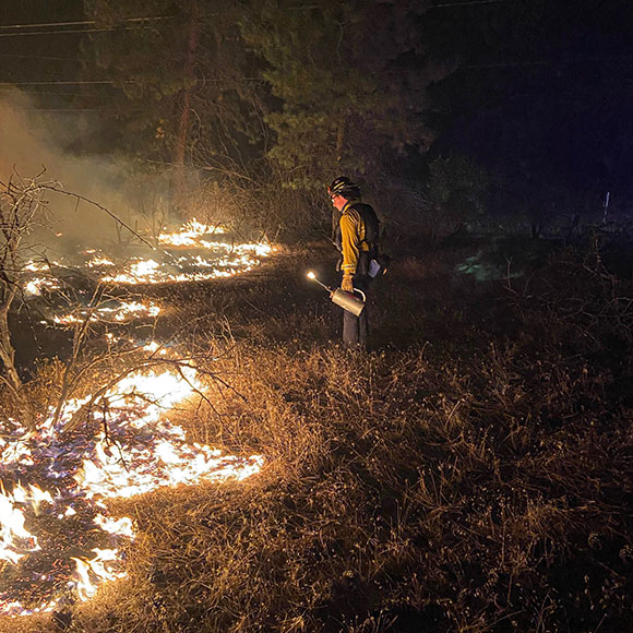 firefighter on a back burn
