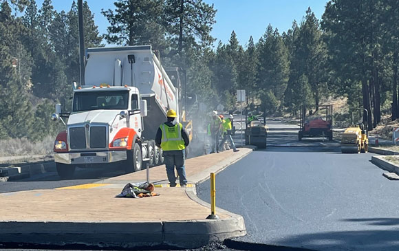 Construction crew paving a roadway