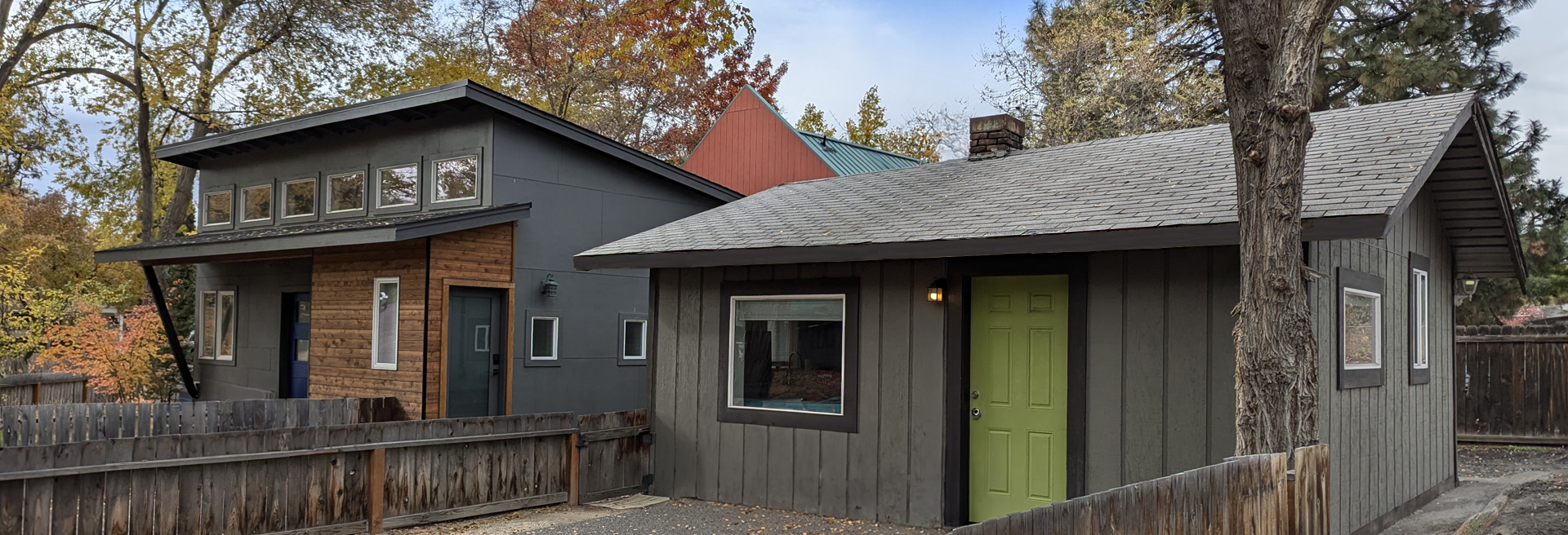 Accessory Dwelling Unit next to a home, gray color, gray roof, green door