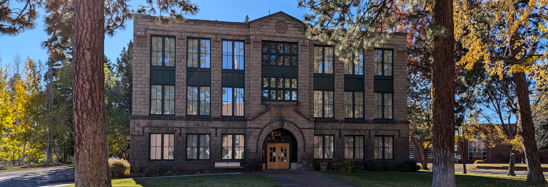 Reid School historical building. Brown brick, three stories tall.