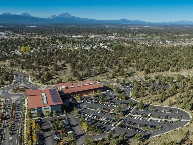 Shot of Juniper Ridge overhead. Les Schwab headquarters in the foreground, juniper trees and sagebrush in the background.