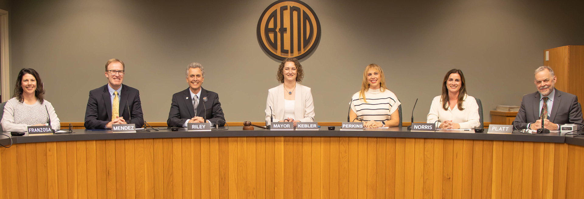 City Council for 25-27 sitting behind the diesis in Council Chambers. 