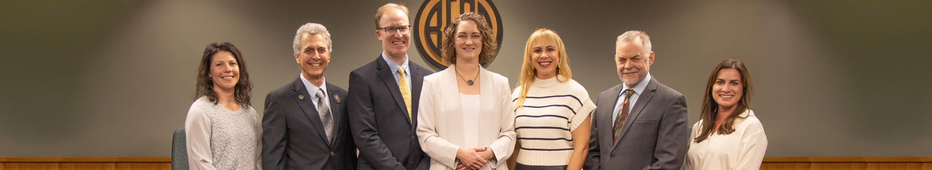 City Council for 25-27 standing in front of the diesis in Council Chambers.