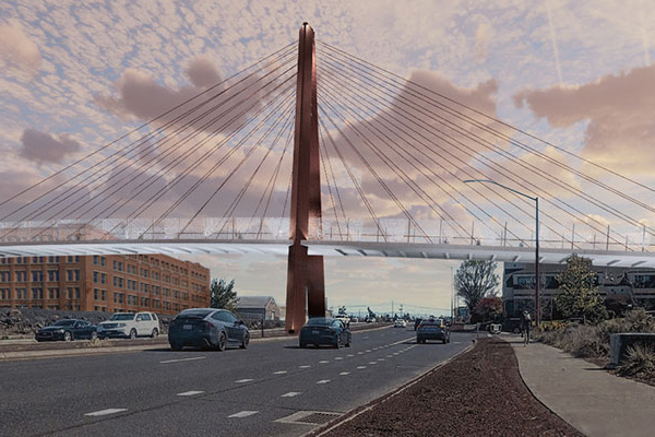 Image of bridge spanning the Bend Parkway. Cars are driving on the parkway.