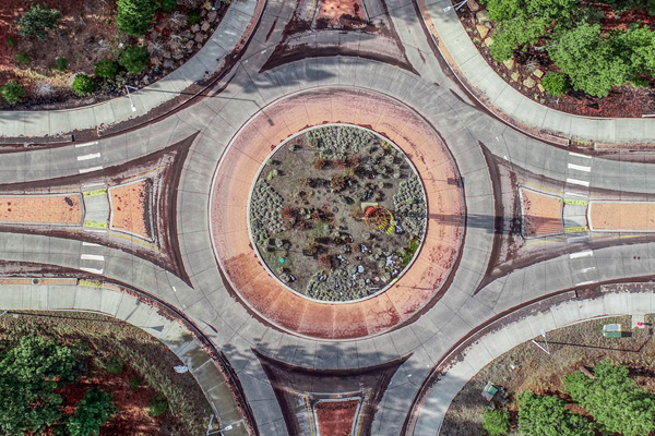 Image of a traffic circle directly overhead.