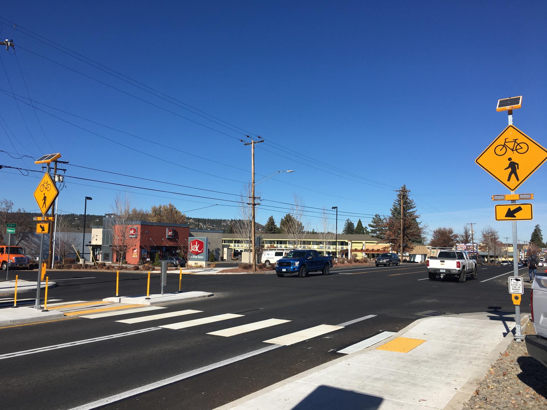 crosswalk and flashing beacons at 3rd Street and Hawthorne Avenue